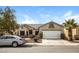 Charming single-story home featuring a two-car garage, desert landscaping, and a well-maintained front yard at 5127 Fiji Island Ct, North Las Vegas, NV 89031