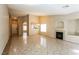 Bright living room with neutral walls, tile flooring, and a fireplace at 5127 Fiji Island Ct, North Las Vegas, NV 89031