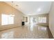 Spacious living room with tile flooring, a fireplace, and lots of natural light from the sliding glass door at 5127 Fiji Island Ct, North Las Vegas, NV 89031