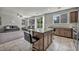 Open concept kitchen with granite countertops, stainless steel appliances, and seamlessly connected to the living room at 5232 Mountain Garland Ln, North Las Vegas, NV 89081