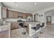 Modern kitchen with granite countertops, stainless steel appliances, and a center island with barstool seating at 5232 Mountain Garland Ln, North Las Vegas, NV 89081