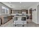 Modern kitchen with granite countertops, stainless steel appliances, and a center island with barstool seating at 5232 Mountain Garland Ln, North Las Vegas, NV 89081