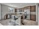 Modern kitchen with granite countertops, stainless steel appliances, and a center island with barstool seating at 5232 Mountain Garland Ln, North Las Vegas, NV 89081