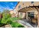 The backyard has a covered patio and plenty of green space at 5513 Nickel Ridge Way, Las Vegas, NV 89122