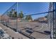 Community basketball court, enclosed by a chain-link fence and adjacent to neighborhood homes at 5513 Nickel Ridge Way, Las Vegas, NV 89122