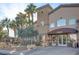 Attractive Copper Creek clubhouse entrance featuring manicured landscaping and covered entry at 5513 Nickel Ridge Way, Las Vegas, NV 89122