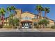 Stately community clubhouse with palm trees, desert landscaping, and a convenient drive-up golf cart at 5513 Nickel Ridge Way, Las Vegas, NV 89122