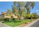 Lush green community lawn area with mature trees, perfect for relaxing and enjoying the outdoors at 5513 Nickel Ridge Way, Las Vegas, NV 89122