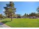 Expansive green community park with playground, picnic tables, and recreational space at 5513 Nickel Ridge Way, Las Vegas, NV 89122