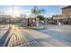 Well maintained community entrance gate for residents, with desert landscaping and mature trees at 5513 Nickel Ridge Way, Las Vegas, NV 89122