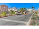 View of community entry gate with guardhouse and automatic vehicle barrier system at 5513 Nickel Ridge Way, Las Vegas, NV 89122