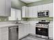 Updated kitchen offering stainless steel appliances, plenty of counter space and natural light at 5513 Nickel Ridge Way, Las Vegas, NV 89122