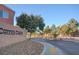 Inviting Copper Creek community entrance with stone signage and well-maintained landscaping at 5513 Nickel Ridge Way, Las Vegas, NV 89122
