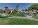 Community playground with play structures, picnic tables, and grassy area for Gathering fun at 5513 Nickel Ridge Way, Las Vegas, NV 89122
