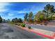 Street view of Copper Creek community entrance sign and landscaped median at 5513 Nickel Ridge Way, Las Vegas, NV 89122