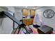 Bonus room features cabinets, refrigerator, sink, decorations, and a pull down workout machine on colorful floor mat at 5527 Breecher Ave, Las Vegas, NV 89131