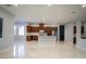 Open floor plan showcasing modern kitchen with stainless steel appliances and island at 5527 Breecher Ave, Las Vegas, NV 89131