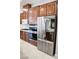 Modern kitchen with stainless steel appliances and dark wood cabinetry at 5527 Breecher Ave, Las Vegas, NV 89131