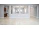Spacious living room with a neutral color palette, wood floors, and lots of natural light at 5527 Breecher Ave, Las Vegas, NV 89131
