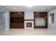 Spacious living room featuring a fireplace and custom built-in cabinetry at 5527 Breecher Ave, Las Vegas, NV 89131