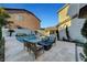 Backyard oasis with in-ground pool, stone patio, desert landscaping and lounge seating at 5712 Almocita Ct, Las Vegas, NV 89141