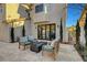 Relaxing backyard patio area featuring a modern fire pit and comfortable seating arrangement at 5712 Almocita Ct, Las Vegas, NV 89141
