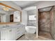 Elegant bathroom featuring a double vanity, modern tub, and glass walk-in shower at 5712 Almocita Ct, Las Vegas, NV 89141