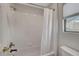Bright white bathroom featuring a shower and tub combination at 5712 Almocita Ct, Las Vegas, NV 89141