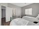 Shared bedroom with two twin beds and wood floors; an inviting and comfortable space at 5712 Almocita Ct, Las Vegas, NV 89141
