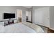 Comfortable bedroom with closet and TV, providing both storage and entertainment at 5712 Almocita Ct, Las Vegas, NV 89141