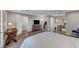Spacious bedroom suite featuring a kitchenette, desk, and multiple seating areas at 5712 Almocita Ct, Las Vegas, NV 89141