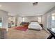 Large bedroom suite with kitchenette, living area, and access to balcony at 5712 Almocita Ct, Las Vegas, NV 89141