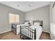 Shared bedroom with two twin beds and wood floors, perfect for guests or children at 5712 Almocita Ct, Las Vegas, NV 89141