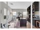 Modern home office with built-in shelving, large desk, and ample natural light at 5712 Almocita Ct, Las Vegas, NV 89141