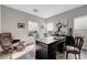 Well-lit home office with a comfortable chair, large desk, and a view of the outdoors at 5712 Almocita Ct, Las Vegas, NV 89141