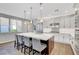 Bright kitchen with a large island, modern cabinetry, stainless steel appliances and stylish pendant lighting at 5712 Almocita Ct, Las Vegas, NV 89141