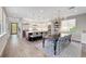Open concept kitchen with an island, stainless steel appliances, and adjacent dining area at 5712 Almocita Ct, Las Vegas, NV 89141