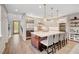 Spacious kitchen featuring a large island with seating, stainless steel appliances and modern finishes at 5712 Almocita Ct, Las Vegas, NV 89141