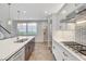 Modern kitchen featuring white cabinets, stainless steel appliances, and sleek countertops at 5712 Almocita Ct, Las Vegas, NV 89141