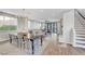 Open-concept living space features wood floors, a dining area, and comfortable seating at 5712 Almocita Ct, Las Vegas, NV 89141