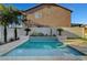 Beautiful backyard pool with a sleek design, complemented by lush landscaping at 5712 Almocita Ct, Las Vegas, NV 89141