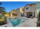 Gorgeous outdoor pool area with seamless indoor-outdoor living and elegant architectural design at 5712 Almocita Ct, Las Vegas, NV 89141