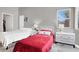 Bright bedroom features two twin beds, neutral walls, and natural light from the window at 5954 Rose Sage St, North Las Vegas, NV 89031