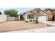 Attractive single-story home with low maintenance landscaping, convenient two-car garage, and inviting curb appeal at 5954 Rose Sage St, North Las Vegas, NV 89031
