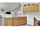 Bright kitchen featuring a stainless steel sink, ample counter space, and a dishwasher for convenience at 5954 Rose Sage St, North Las Vegas, NV 89031