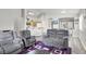 Spacious open-concept living area flows into a kitchen and dining space, perfect for modern living at 5954 Rose Sage St, North Las Vegas, NV 89031