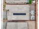 Aerial view of a single-story home with solar panels, a paved patio, and low-maintenance landscaping at 6261 Lamont Hills Ave, Las Vegas, NV 89139