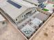 An aerial view of a stylish backyard with stone pavers, gravel, and desert landscaping at 6261 Lamont Hills Ave, Las Vegas, NV 89139