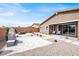 Backyard patio with pavers, rock features, and outdoor seating for entertaining guests at 6261 Lamont Hills Ave, Las Vegas, NV 89139