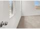 Bright bedroom with wall-to-wall carpeting and two large windows at 6261 Lamont Hills Ave, Las Vegas, NV 89139